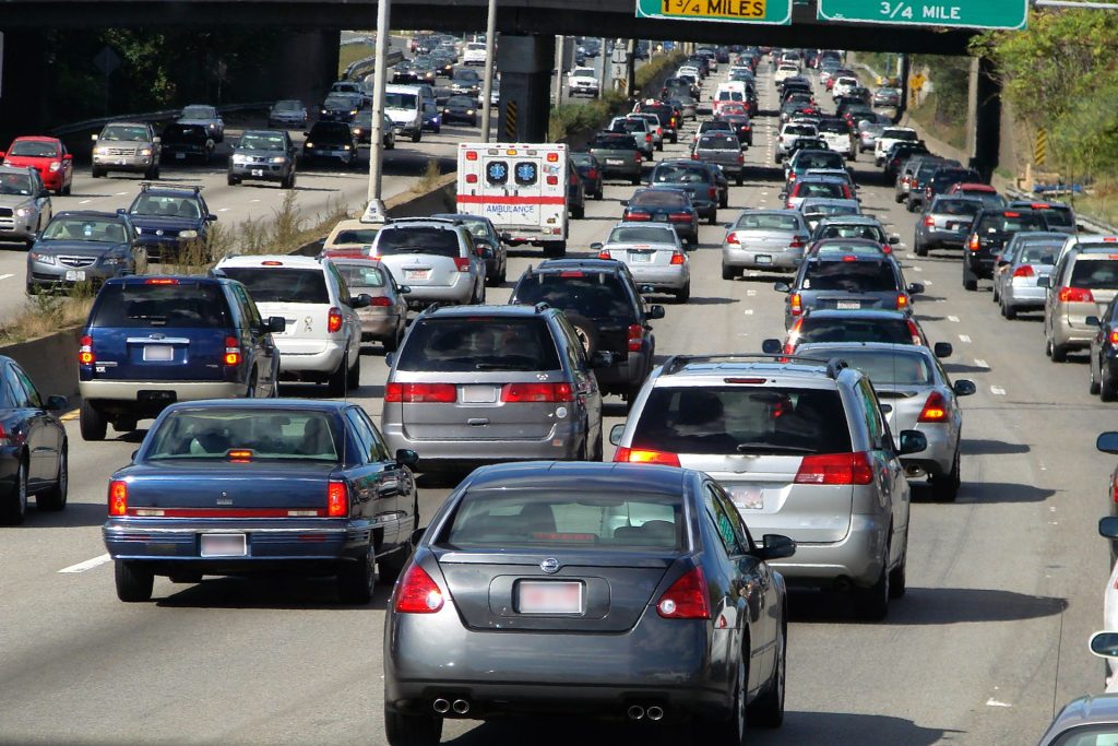 A busy freeway with backed-up traffic.